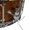 Close-up of snare drum with microphone for live drumming performance.