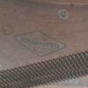 Close-up of Craviotto drum component with metal mesh detail.