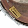 Close-up of a Craviotto drum part with metal hardware and wood finish.