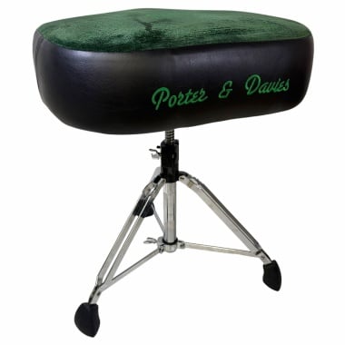 Professional drum throne seat with green and black upholstery for drummers.