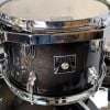 Close-up of Tama Superstar Classic drum with maple shell and chrome hardware.