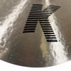 Close-up of Zildjian K Custom 20in Dark Ride cymbal with logo detail.