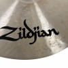 Close-up of Zildjian logo on a dark ride cymbal for drums.