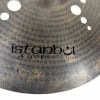Close-up of Istanbul Xist 21-inch Ion Dark Ride cymbal with logo visible.