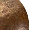 Close-up of a bronze cymbal with a textured, hammered surface.