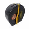 Hard drum case with yellow strap for protection and transport.