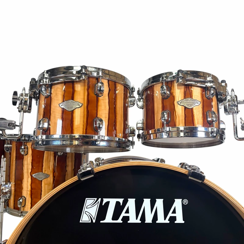 High-quality TAMA drum kit with wooden shells and chrome hardware for professional drumming.