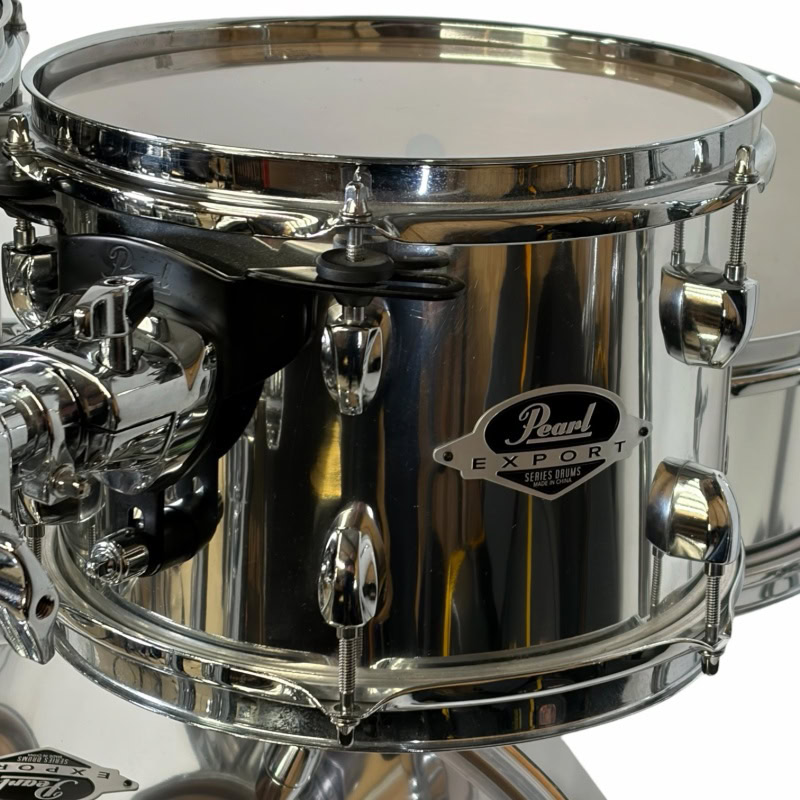 Pearl Export Series drum kit with chrome finish, high-quality hardware, perfect for professional dru.