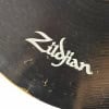 Close-up of Zildjian Pitch Black 22in Ride Cymbal with logo visible.