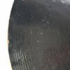 Close-up of a black Zildjian 22-inch ride cymbal with visible grooves.