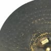 Close-up of black Zildjian 22-inch ride cymbal with detailed grooves and logo.