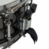 Close-up of steel snare drum tension mechanism and hardware details.