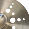 Close-up of Istanbul Xist Ion 18in crash cymbal with holes for sound projection.