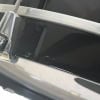 Close-up of drum hardware with metal components and black drum shell.