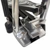 Close-up of a drum bass pedal with metal and chain components.