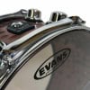 Close-up of Evans snare drum with hardware and logo.