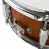 Close-up of Gretsch Catalina Club 14x5in snare drum with wooden shell and chrome hardware.