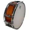 Wooden snare drum with chrome hardware and white drumhead.
