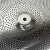 Close-up of a UFO 18-inch China cymbal with perforated surface and central mounting hole.