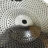 Close-up of a UFO 10-inch splash cymbal with perforations for drumming sound.