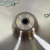 Close-up of Paiste 505 16in China cymbal with detailed grooves and central hole.