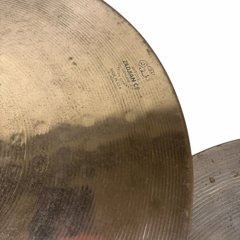 Close-up of Zildjian ZBT 14-inch hi-hat cymbals for drumming.