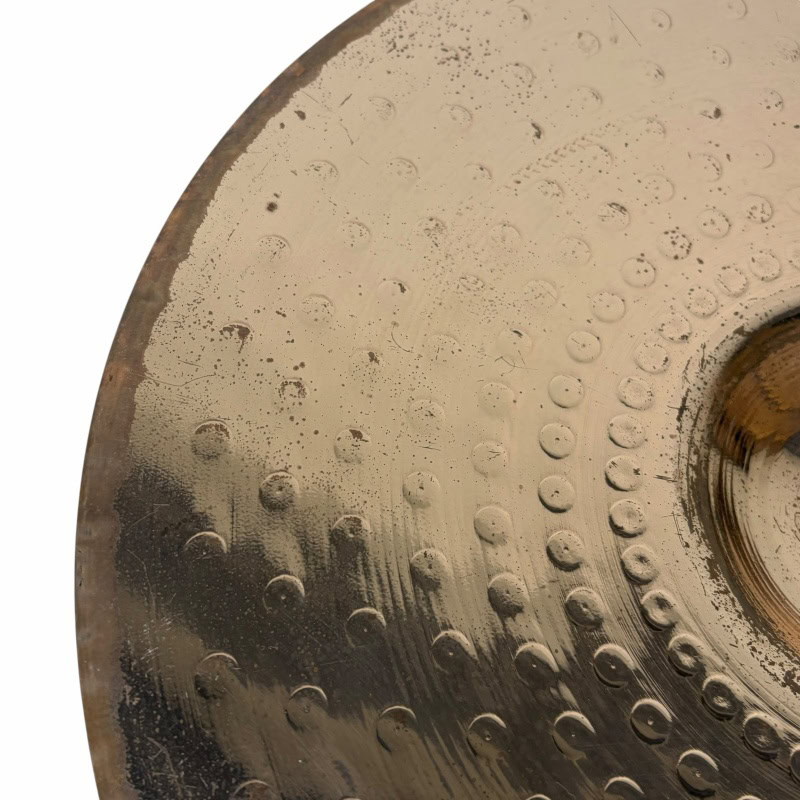 Close-up of Zildjian ZBT 14in hi-hats cymbals with textured surface.