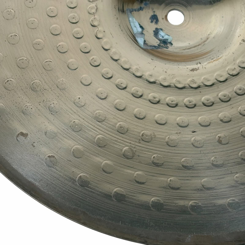 Close-up of Zildjian ZBT 14in hi-hat cymbal with textured surface.