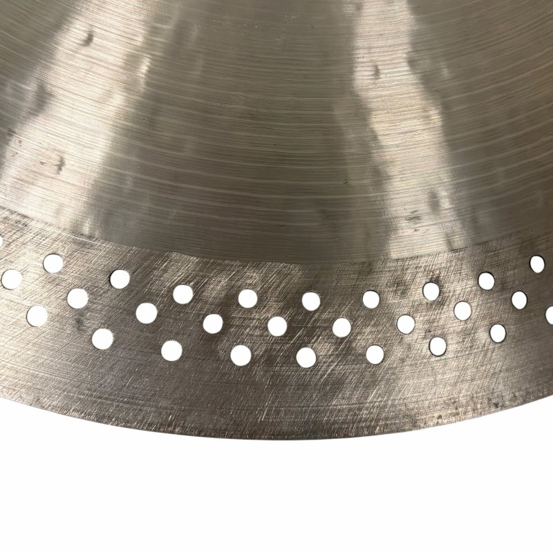 Close-up of a Zildjian A 16in Medium Thin Crash cymbal with perforations.