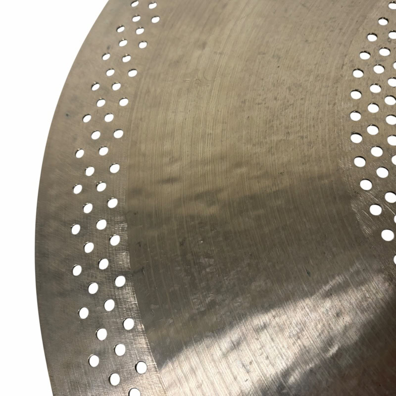 Close-up of Aegean Hush Hush 20in Ride cymbal with perforations.