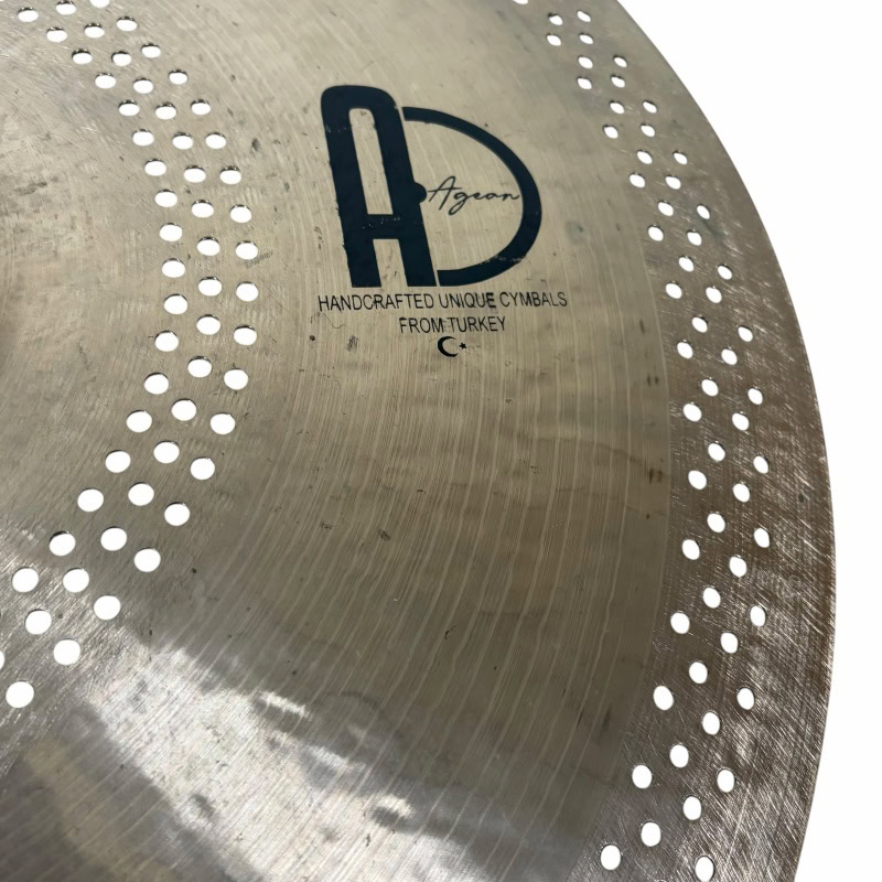 Close-up of Agean Hush Hush 20-inch ride cymbal with perforations.