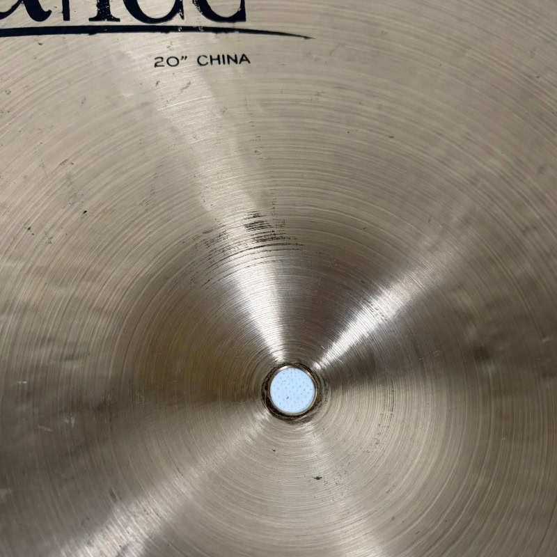 Close-up of Meinl Byzance 20in China cymbal surface with detailed grooves.