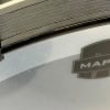 Close-up of Mapex Meridian Black drum shell with logo visible.