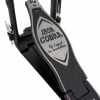 Close-up of Tama Iron Cobra bass drum pedal with logo and footplate details.