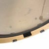 Close-up of drum shell with hardware and clear drumhead.