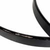 Close-up of black bass drum hoops with minor wear and tear.