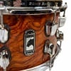 Close-up of Mapex Black Panther snare drum with wood finish and chrome hardware.