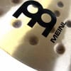 Meinl logo on a hammered alloy cymbal for drums.