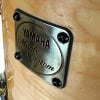 Yamaha Maple Custom drum shell with metal badge and wood finish.
