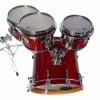 Red drum kit with three toms and bass drum, professional quality.