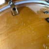 Close-up of a wooden drum shell with water droplets, part of Yamaha Maple Custom 5pc set.