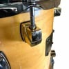 Close-up of drum shell with tuning hardware and hardware details.