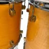 Close-up of Yamaha Maple Custom drum shells with hardware.