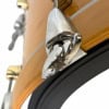 Close-up of a drum clamp securing a drum to a wooden stand.