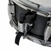 Close-up of snare drum mounting hardware and tensioner.