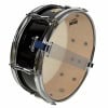Yamaha snare drum with black finish and clear drumhead for professional drumming.