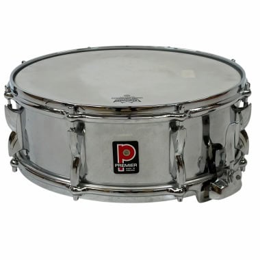 Steel snare drum with Premier logo, shiny chrome finish, and hardware.