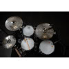 Drums and cymbals set with sticks viewed from above.