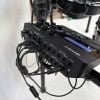 Close-up of Roland TD-27KV electronic drum module with cables connected.