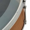 Close-up of drum shell with metal rim and hardware details.